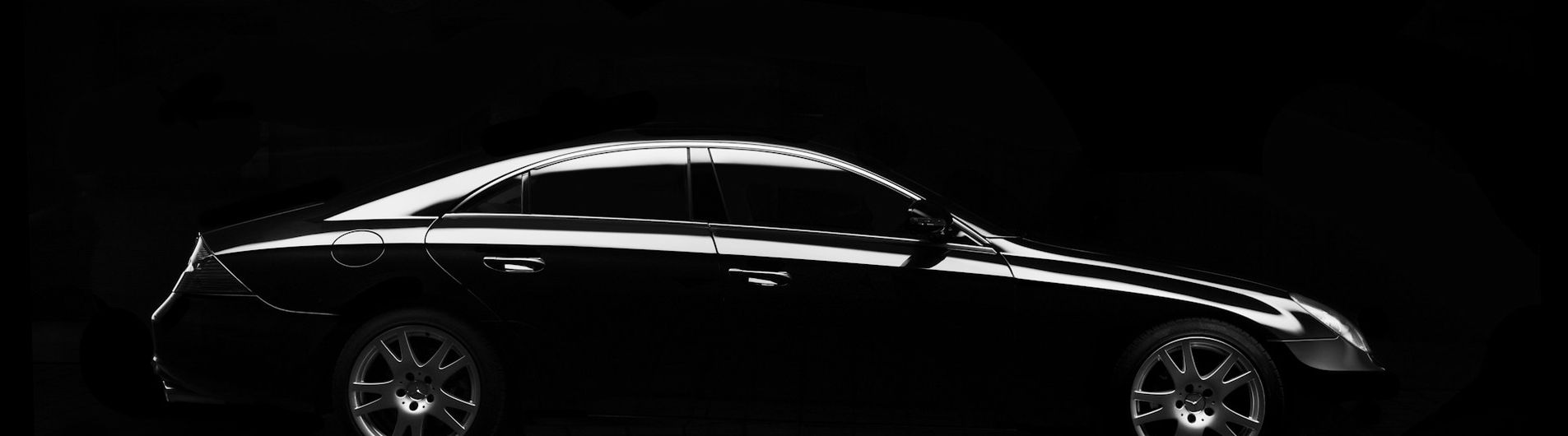 freshly detailed black sedan with a mirror-gloss finish
