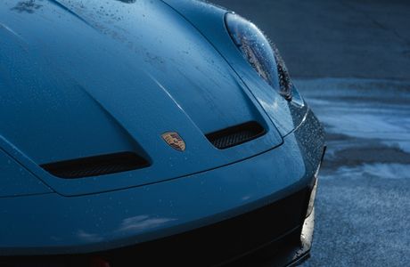 water beading on a freshly ceramic coated blue Porsche