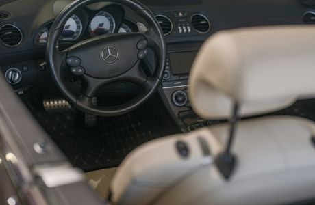 clean light-colored seats and carpet inside a luxury car