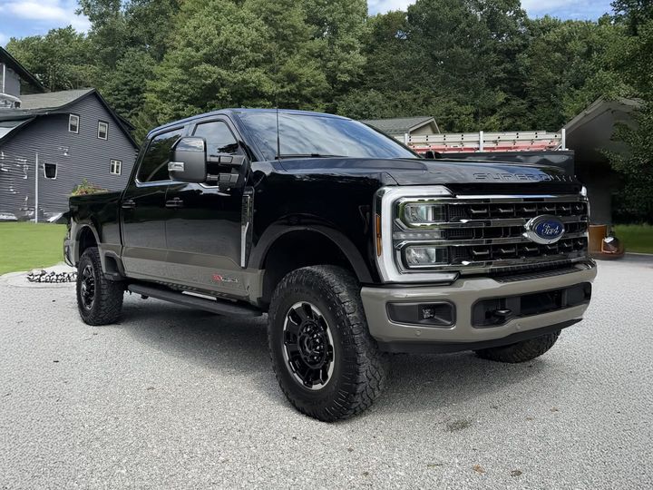 black Ford F-250 Tremor gleaming after a full detail