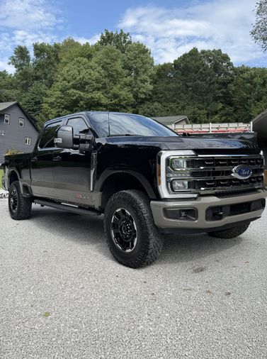 black Ford F-250 Tremor side profile after detailing