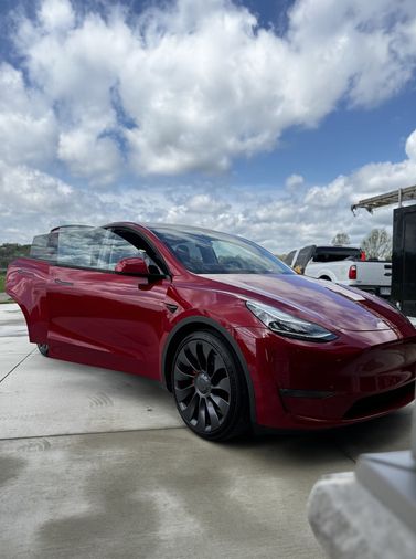 red Tesla after a mobile detail