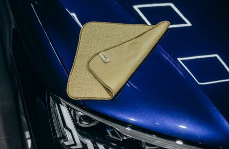 microfiber towel on a glossy sealed blue hood