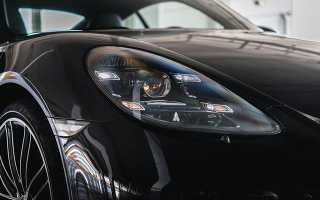 close-up of flawless coated black paint and headlight