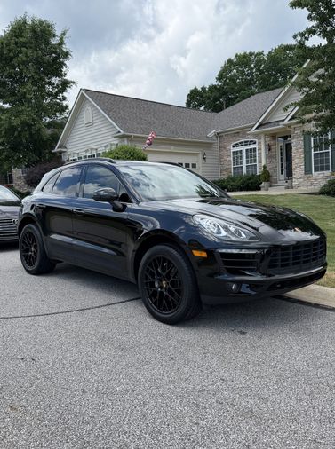 black Porsche Macan detailed in a customer driveway